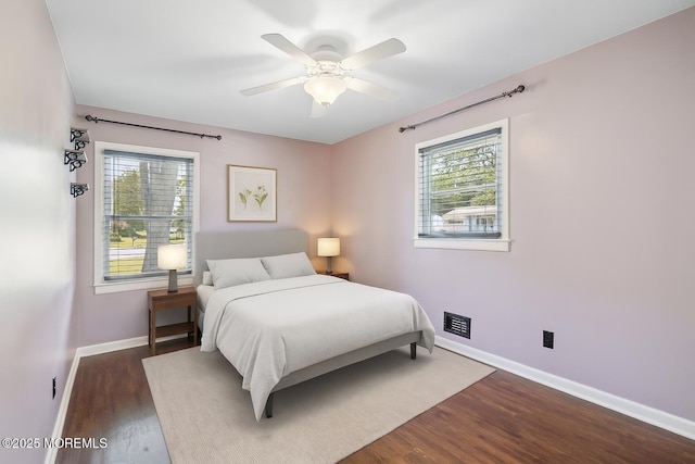 6 Redwood Rd, Howell, NJ 07731 - bedroom featuring multiple windows, dark wood-style flooring, and a ceiling fan