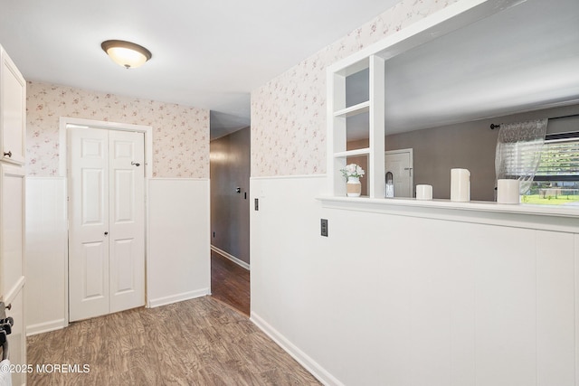 6 Redwood Rd, Howell, NJ 07731 - corridor with wainscoting, wallpapered walls, and wood finished floors