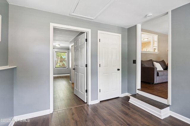 6 Redwood Rd, Howell, NJ 07731 - hallway featuring dark wood-style flooring and baseboards