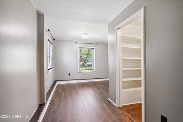 6 Redwood Rd, Howell, NJ 07731 - hallway featuring dark wood-type flooring and baseboards