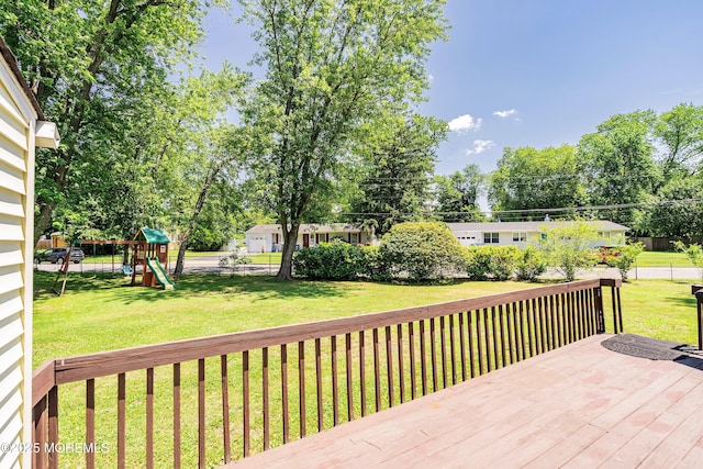 6 Redwood Rd, Howell, NJ 07731 - wooden deck with a playground and view of wooded area
