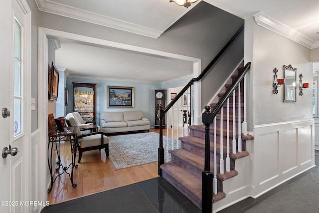 86 Lorelei Dr, Howell, NJ 07731 - foyer featuring ornamental molding, stairs, wood finished floors, and a wainscoted wall