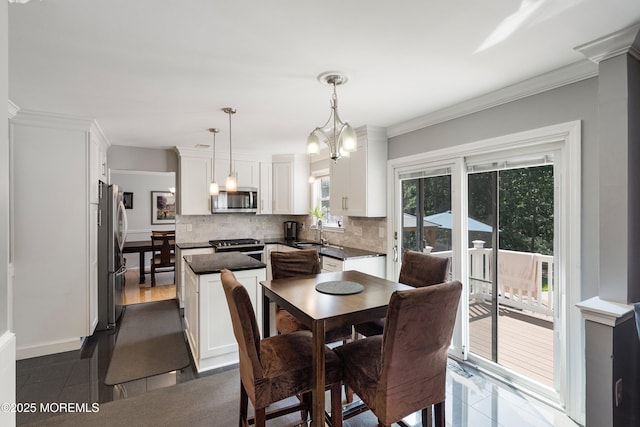 86 Lorelei Dr, Howell, NJ 07731 - dining area with crown molding and a chandelier