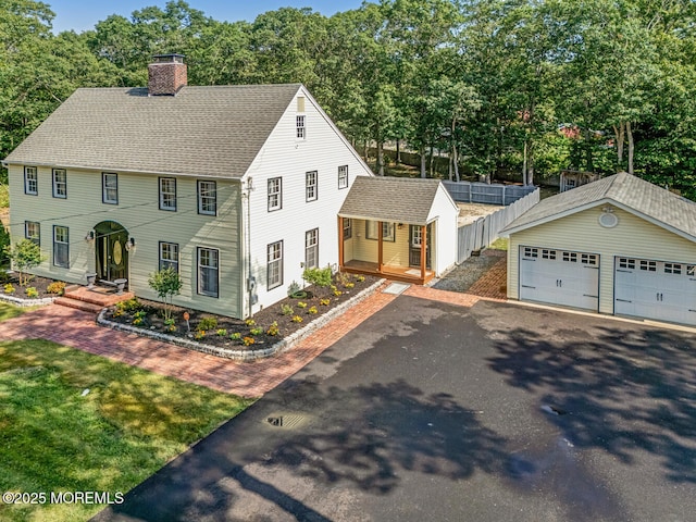 215 Parkertown Dr, Little Egg Harbor, NJ 08087 - colonial house featuring an outdoor structure, a chimney, a detached garage, and roof with shingles