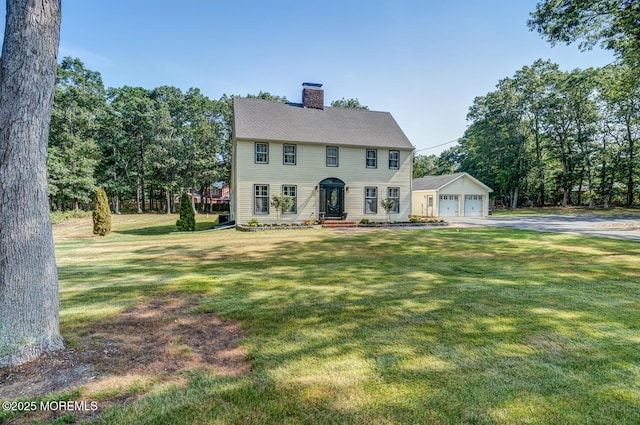 215 Parkertown Dr, Little Egg Harbor, NJ 08087 - colonial home with a chimney, a front lawn, and a detached garage