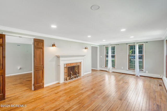 215 Parkertown Dr, Little Egg Harbor, NJ 08087 - unfurnished living room featuring crown molding, light wood-style floors, a fireplace, and recessed lighting