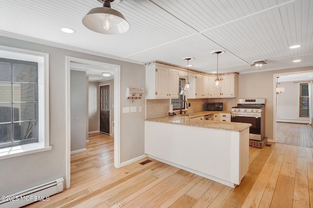 215 Parkertown Dr, Little Egg Harbor, NJ 08087 - kitchen featuring stainless steel appliances, baseboard heating, a peninsula, tasteful backsplash, and light wood-style floors
