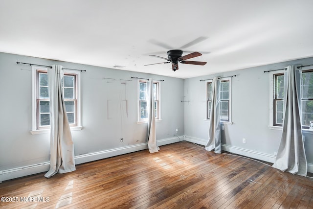 215 Parkertown Dr, Little Egg Harbor, NJ 08087 - unfurnished bedroom with wood-type flooring, baseboard heating, multiple windows, and a ceiling fan