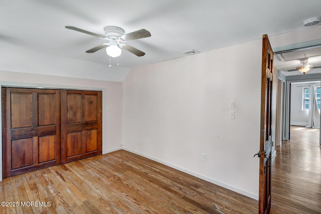 215 Parkertown Dr, Little Egg Harbor, NJ 08087 - unfurnished bedroom featuring attic access, light wood finished floors, ceiling fan, and lofted ceiling