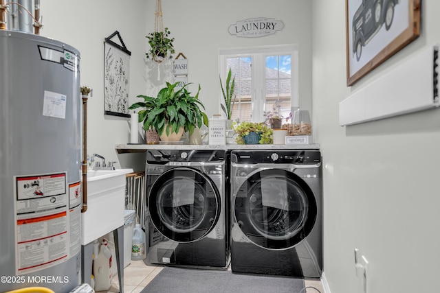 16 Vecchio Rd, Manchester, NJ 08759 - laundry room with gas water heater, washing machine and dryer, and light tile patterned flooring