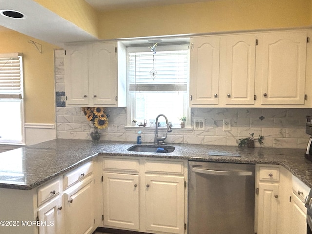 2711 2nd Ave, Toms River, NJ 08753 - kitchen featuring dishwasher, white cabinets, a peninsula, and decorative backsplash