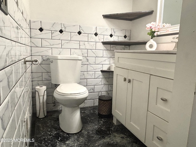2711 2nd Ave, Toms River, NJ 08753 - half bathroom featuring marble finish floors, vanity, tile walls, and a wainscoted wall