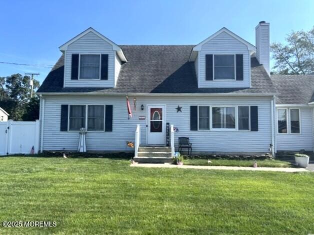 2711 2nd Ave, Toms River, NJ 08753 - new england style home featuring a chimney and a gate
