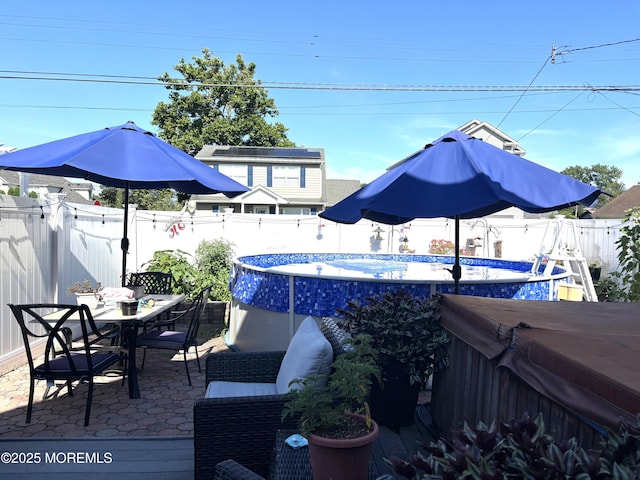 2711 2nd Ave, Toms River, NJ 08753 - fenced backyard with outdoor dining area, a hot tub, and a patio