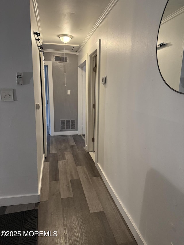 153 Schooner Ave, Barnegat, NJ 08005 - hallway featuring ornamental molding, dark wood finished floors, and attic access