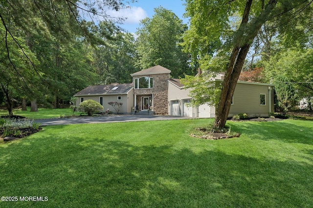 2 Derby Ln, East Brunswick, NJ 08816 - view of front of property featuring stone siding, a front yard, and driveway
