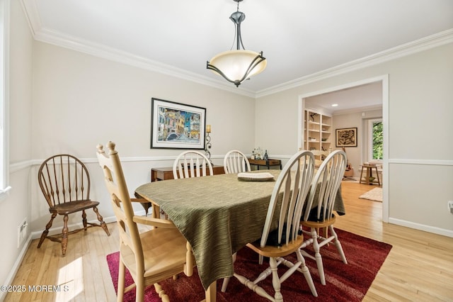 2 Derby Ln, East Brunswick, NJ 08816 - dining area with light wood-type flooring and crown molding
