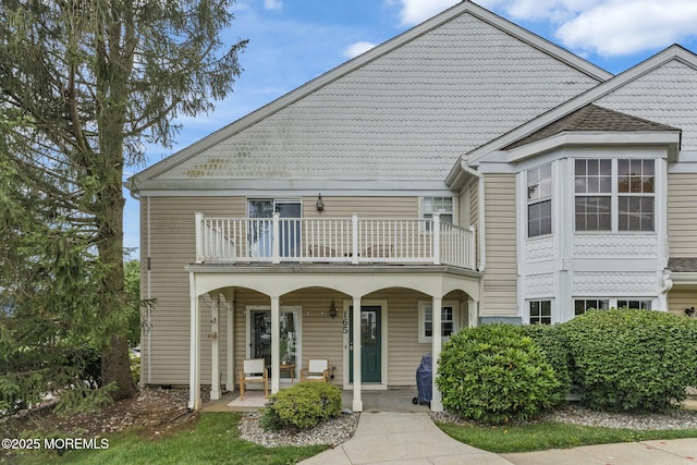 165 Tulip Ln, Freehold, NJ 07728 - view of front facade with a balcony and a porch