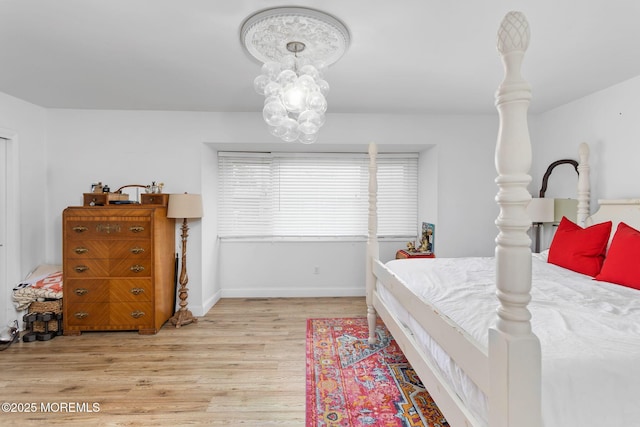 401 Jefferson Dr, East Windsor, NJ 08520 - bedroom featuring light wood-style flooring and a chandelier
