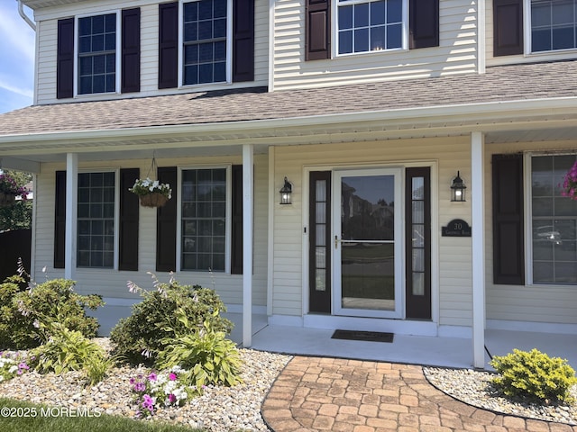 30 Gristmill Rd, Howell, NJ 07731 - doorway to property featuring covered porch and a shingled roof