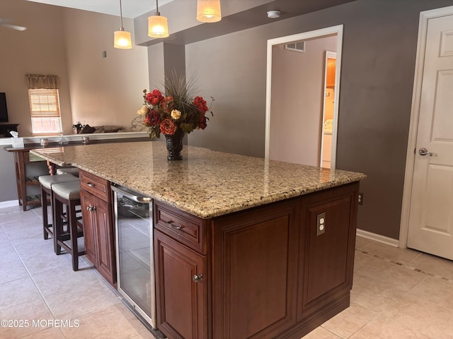 30 Gristmill Rd, Howell, NJ 07731 - kitchen featuring beverage cooler, light tile patterned floors, a center island, and hanging light fixtures