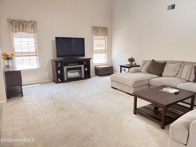 30 Gristmill Rd, Howell, NJ 07731 - living room with carpet flooring and a glass covered fireplace