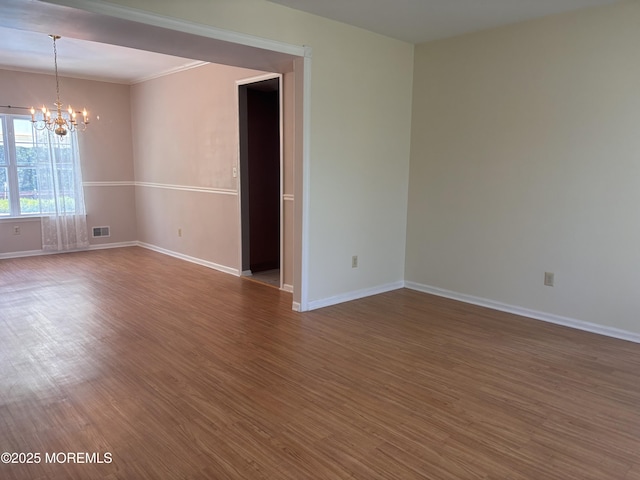 30 Gristmill Rd, Howell, NJ 07731 - empty room with a chandelier, wood finished floors, and crown molding