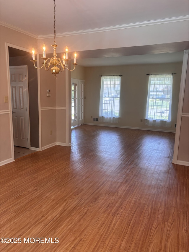 30 Gristmill Rd, Howell, NJ 07731 - spare room featuring a chandelier, light wood-style floors, and crown molding
