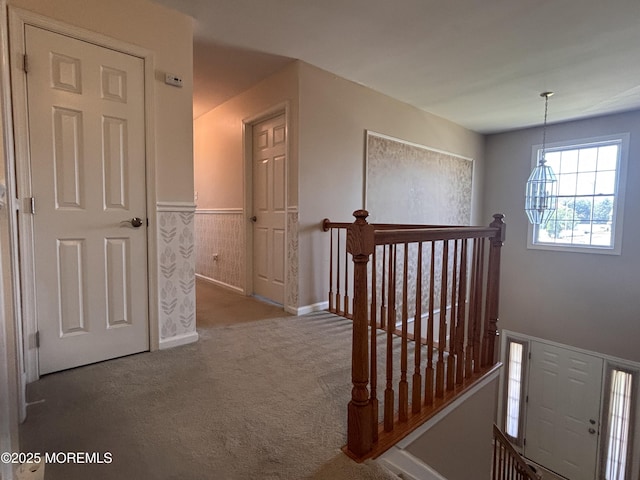 30 Gristmill Rd, Howell, NJ 07731 - hallway with an upstairs landing, carpet floors, and wainscoting