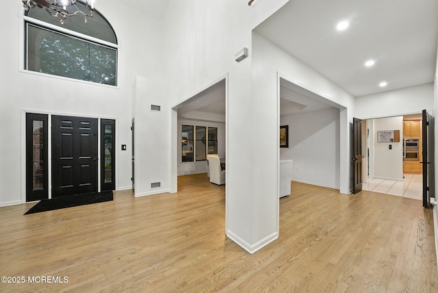 8 Shadowbrook Dr, Colts Neck, NJ 07722 - foyer entrance featuring light wood finished floors, recessed lighting, and a chandelier