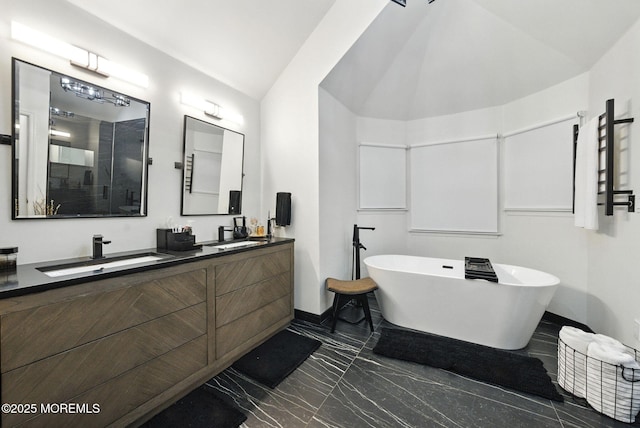 8 Shadowbrook Dr, Colts Neck, NJ 07722 - full bath with marble tiled flooring, vaulted ceiling, double vanity, a freestanding tub, and a shower