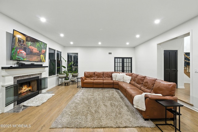 8 Shadowbrook Dr, Colts Neck, NJ 07722 - living room featuring recessed lighting, a lit fireplace, and wood finished floors