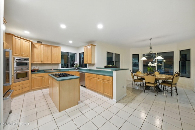 8 Shadowbrook Dr, Colts Neck, NJ 07722 - kitchen featuring light brown cabinets, stainless steel appliances, decorative backsplash, a kitchen island, and a peninsula