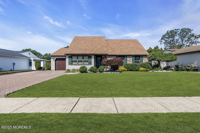 18 Laurel Crest Dr, Howell, NJ 07731 - view of front facade featuring driveway, an attached garage, and a front yard