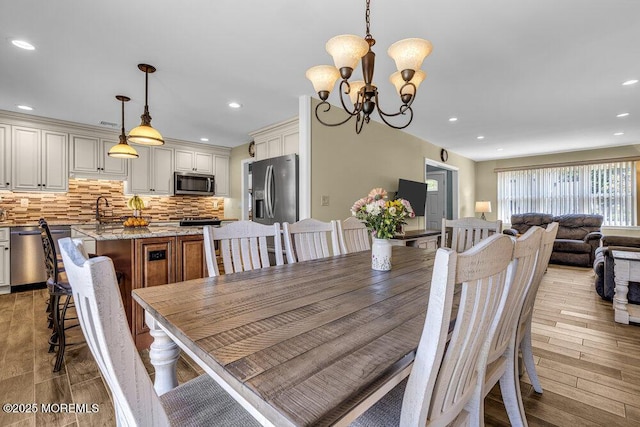 18 Laurel Crest Dr, Howell, NJ 07731 - dining room with light wood finished floors, a chandelier, and recessed lighting