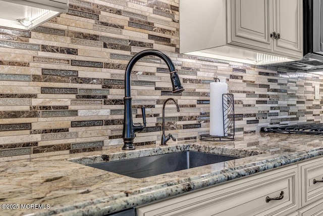 18 Laurel Crest Dr, Howell, NJ 07731 - kitchen view of decorative backsplash, light stone countertops, and cream cabinets