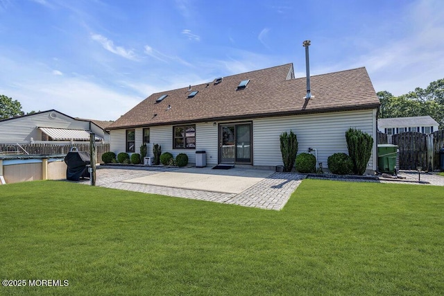 18 Laurel Crest Dr, Howell, NJ 07731 - back of property with a patio and a shingled roof