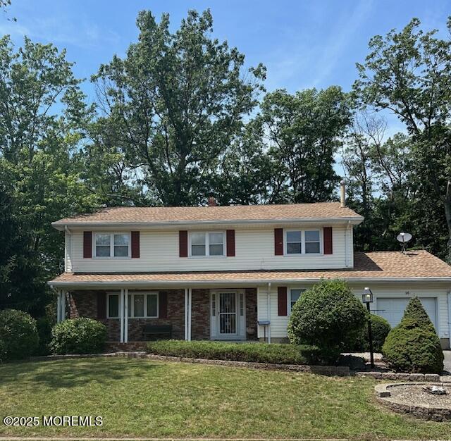 10 Chestnut Hill Rd, Howell, NJ 07731 - view of front of home featuring a garage and a front lawn