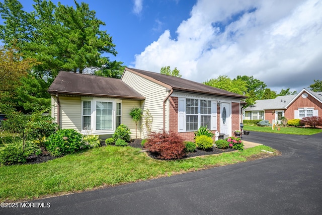 17 Linton Close Close Unit 1000, Freehold, NJ 07728 - view of front of property featuring brick siding and a front lawn