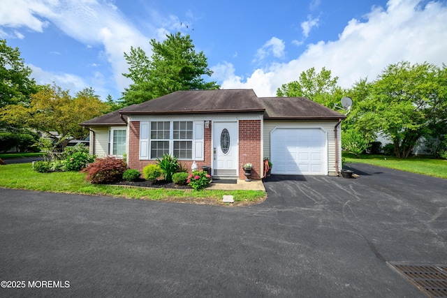 17 Linton Close Close Unit 1000, Freehold, NJ 07728 - view of front of home with an attached garage, driveway, and brick siding