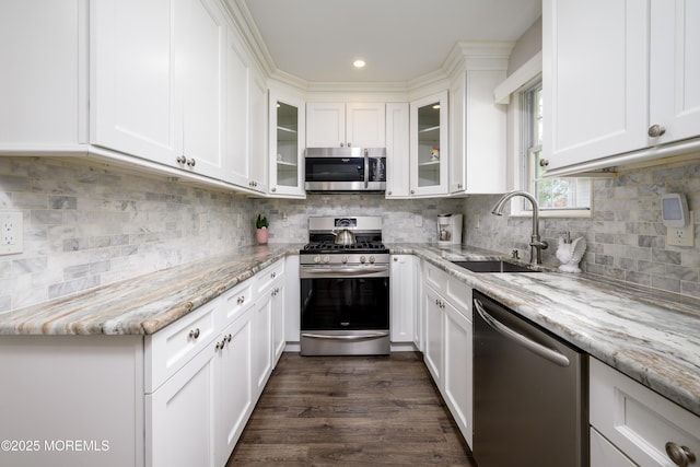17 Linton Close Close Unit 1000, Freehold, NJ 07728 - kitchen featuring appliances with stainless steel finishes, white cabinetry, light stone countertops, glass insert cabinets, and recessed lighting