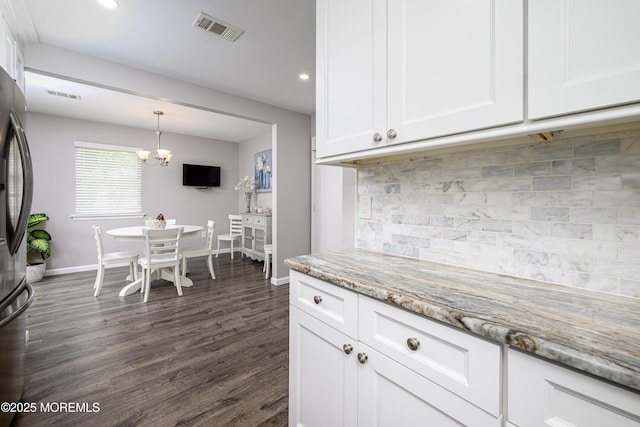 17 Linton Close Close Unit 1000, Freehold, NJ 07728 - kitchen with white cabinets, decorative backsplash, dark wood finished floors, light stone countertops, and recessed lighting