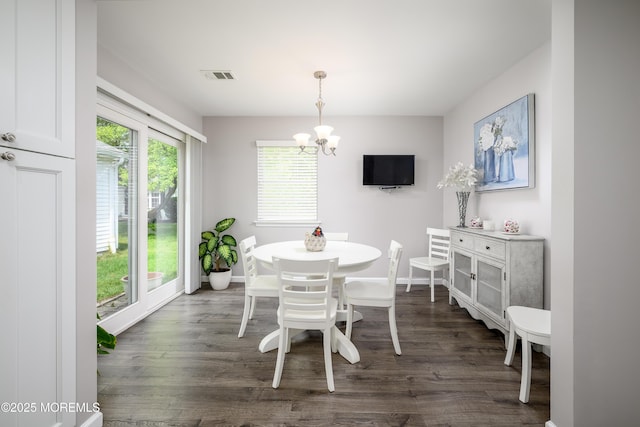 17 Linton Close Close Unit 1000, Freehold, NJ 07728 - dining area with a chandelier and dark wood-style flooring