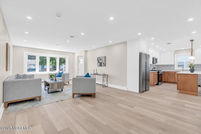 6 Fairfield Rd, Toms River, NJ 08757 - living area featuring light wood-type flooring, recessed lighting, and plenty of natural light