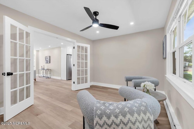 6 Fairfield Rd, Toms River, NJ 08757 - living area with french doors, plenty of natural light, baseboard heating, light wood finished floors, and recessed lighting
