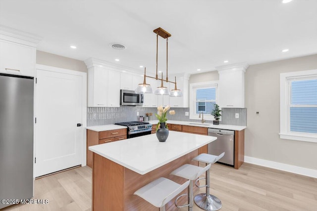 6 Fairfield Rd, Toms River, NJ 08757 - kitchen featuring stainless steel appliances, light wood-type flooring, tasteful backsplash, and recessed lighting