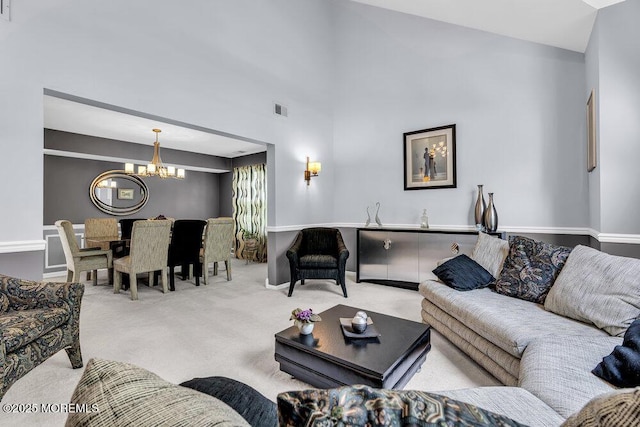 32 Tilton Rd, Brick, NJ 08723 - living area featuring a chandelier, carpet floors, and vaulted ceiling
