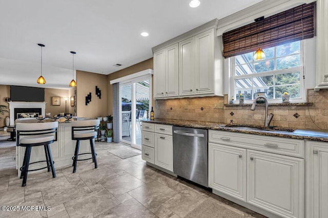 32 Tilton Rd, Brick, NJ 08723 - kitchen featuring stainless steel dishwasher, backsplash, pendant lighting, dark stone countertops, and recessed lighting