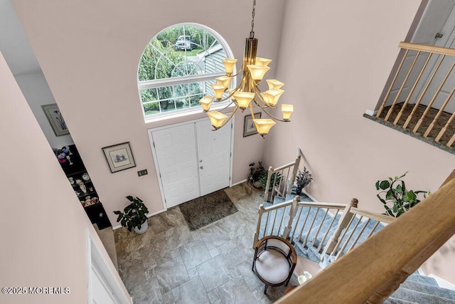 32 Tilton Rd, Brick, NJ 08723 - entryway featuring a chandelier, stairs, and stone finish floors