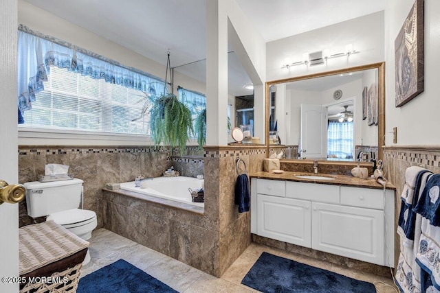 32 Tilton Rd, Brick, NJ 08723 - bathroom with a garden tub, tile walls, vanity, a wainscoted wall, and tile patterned floors